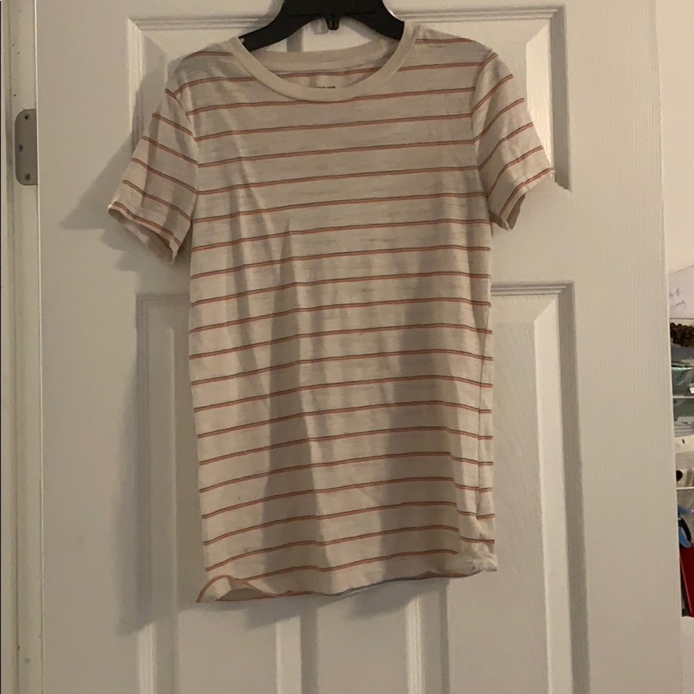 A white tee with blue and light pink stripes